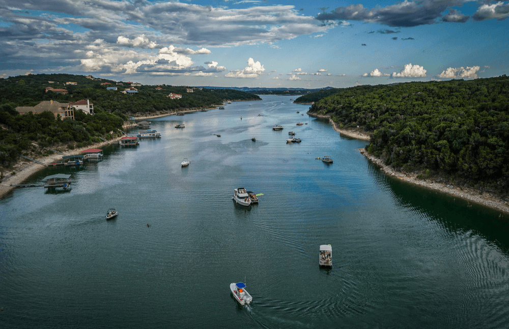 Aerial view of Lake Travis with boats on it.